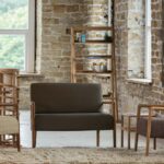 shoreditch armchair, sofa and high back chair. With totem shelf units and mane rug in camel.