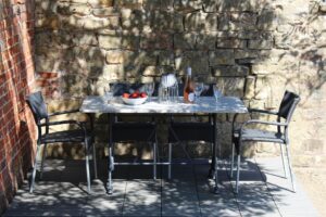 Rollo outdoor dining chairs - slate, sardo granite rectangular top, pigalle rectangular table base