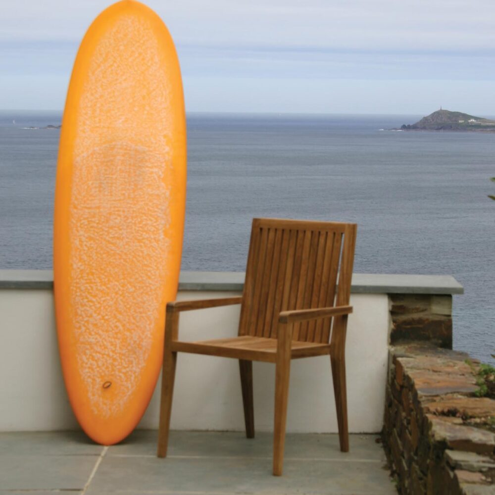 menton outdoor dining armchair - teak - with surf board