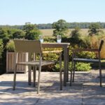 modena outdoor dining armchair & atlantic square outdoor dining table - kubu / teak