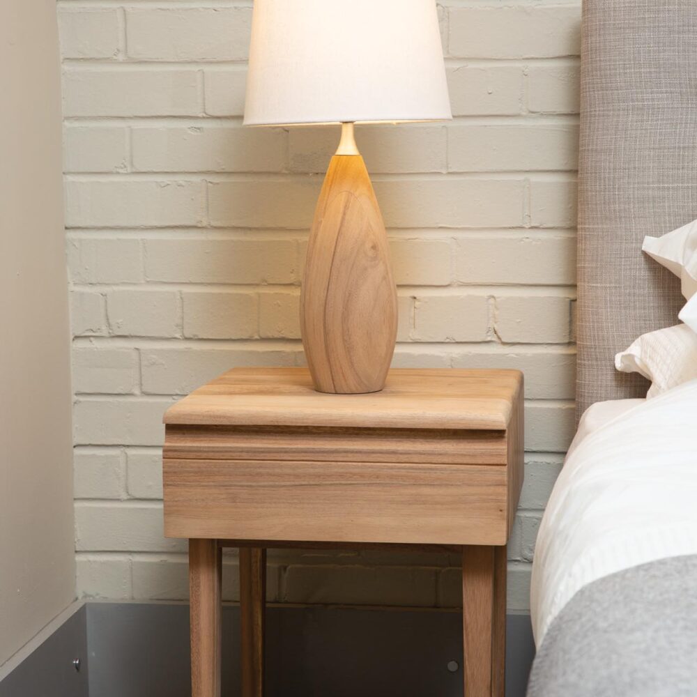 ark wooden bedside table with teardrop lamp and white conical shade