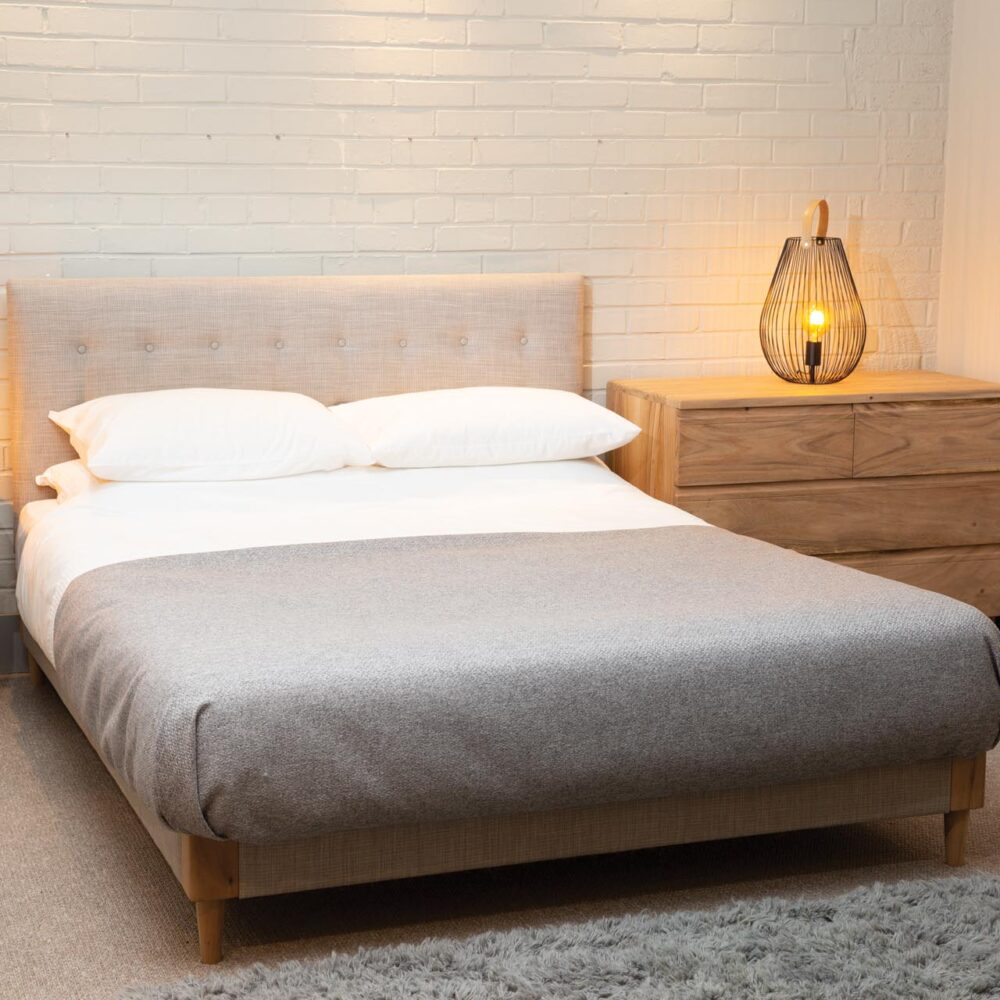 shoreditch upholstered bed with ark bedside & chest of drawers, shoreditch headboard, cage table lamps and mane slate rug.