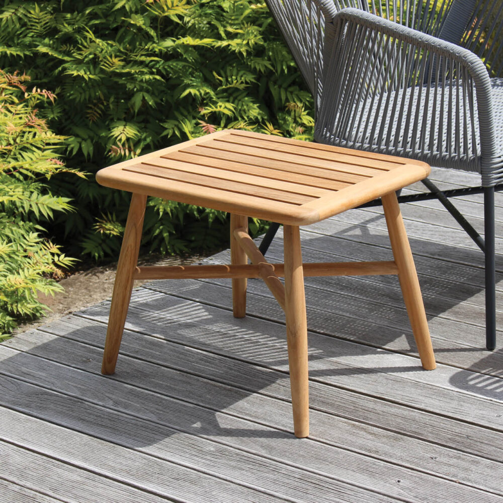 miyako outdoor side table -teak, pictured with armchair