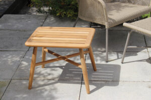 miyako outdoor side table -teak, pictured with armchair