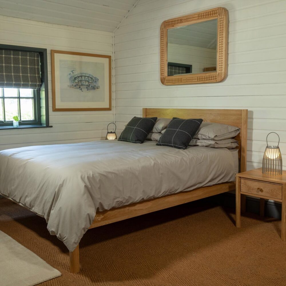 guest bedroom range - oiled oak - guest bed, bedside table and open wardrobe - shown with cleopatra mirror and portman lantern