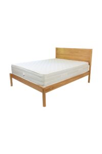 guest solid oak bed frame - double bed size shown with a premium pocket spring mattress