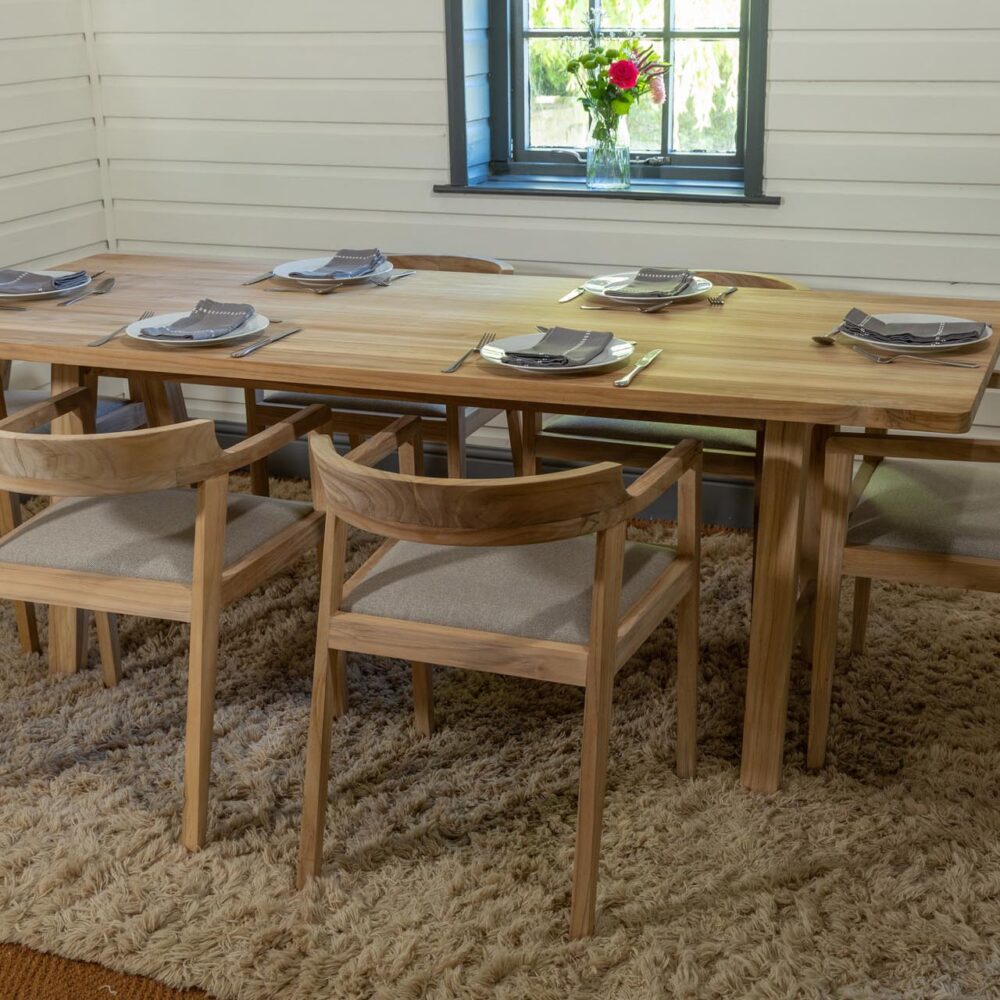 trestle dining table and hampstead chairs - moodshot. shown with repas porcelain, inheritance cutlery and mane camel rug.