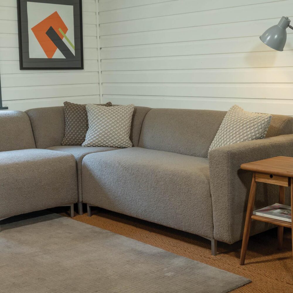 mode sectional seating - example of a corner set up - upholstered in the uk - shown in pelage clay. bruges lamp, shoreditch side table and stitich rug also pictured