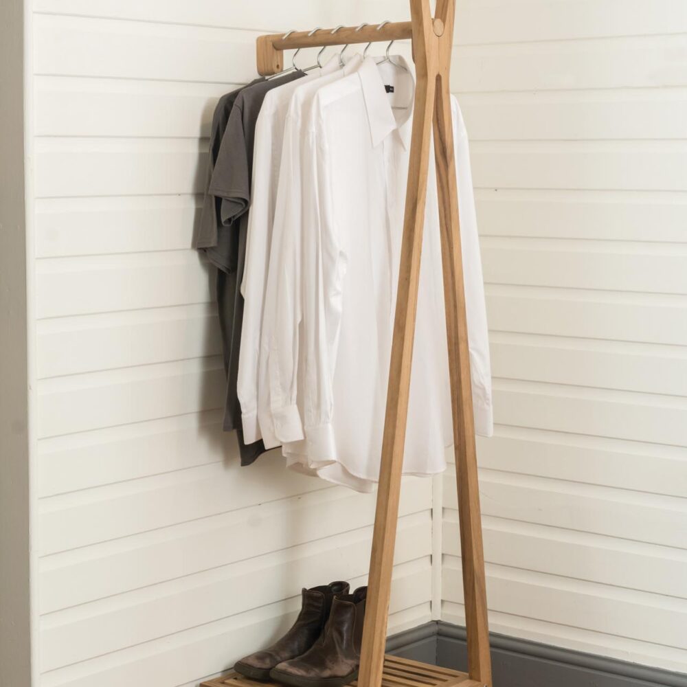 totem wall mounted clothes rail - solid wood clothes rail with lower storage shelf - in situ