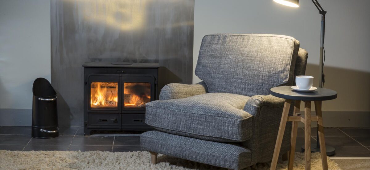 arundel fully upholstered armchair - made in the uk in a choice of fabrics - shown with mane rug + bruge floor lamp