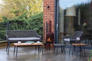 portofino outdoor range - bench, armchair, footstool, coffee and side table - synthetic rope weave, powder coated aluminium legs and slatted teak table tops.