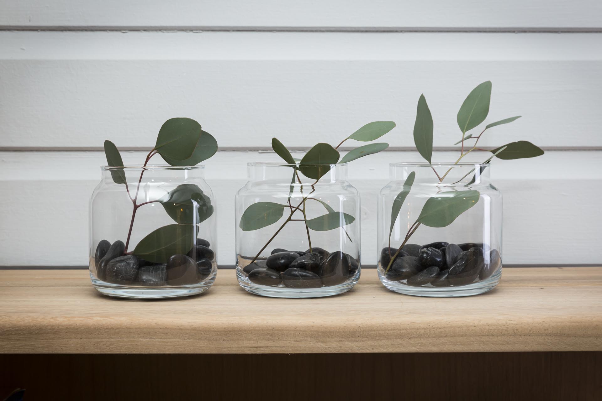 shoulder mini vase - group of three mini vases with pebbles and foliage