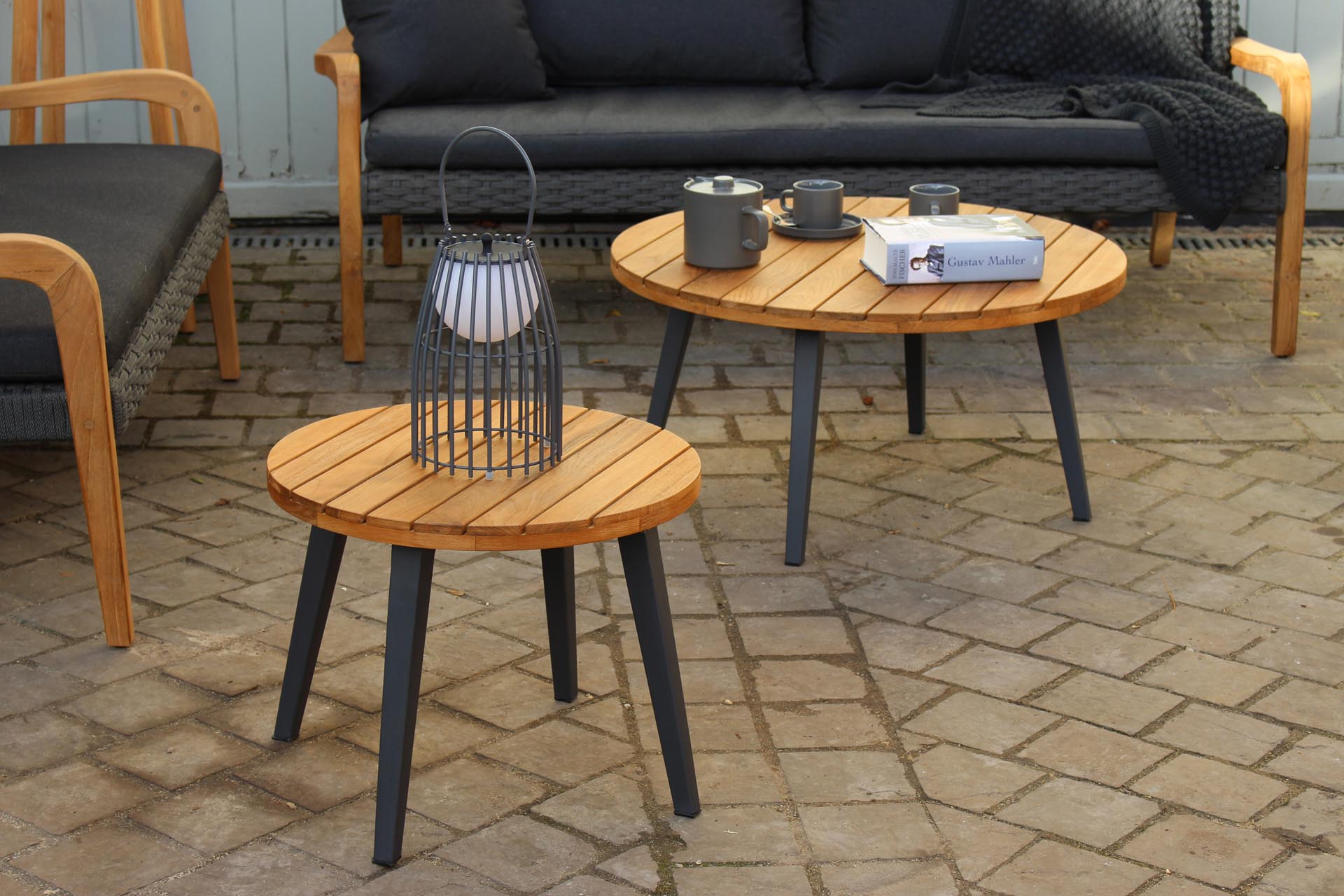 tivoli outdoor occasional tables - coffee and side table in plantation teak and anthracite coloured powder coated aluminium.