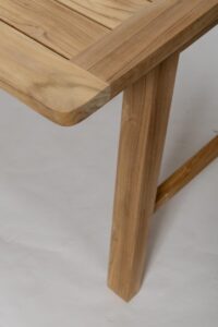 trestle outdoor dining table and bench in plantation teak