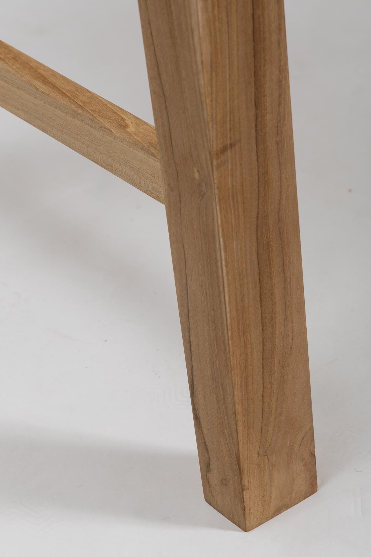 trestle outdoor dining table and bench in plantation teak