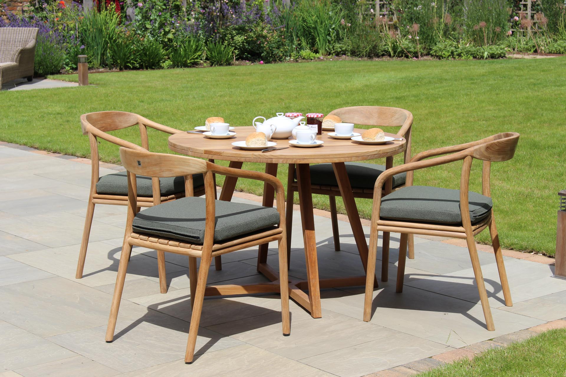 kinsale 110 dining table, dessau outdoor dining chair and repas porcelain