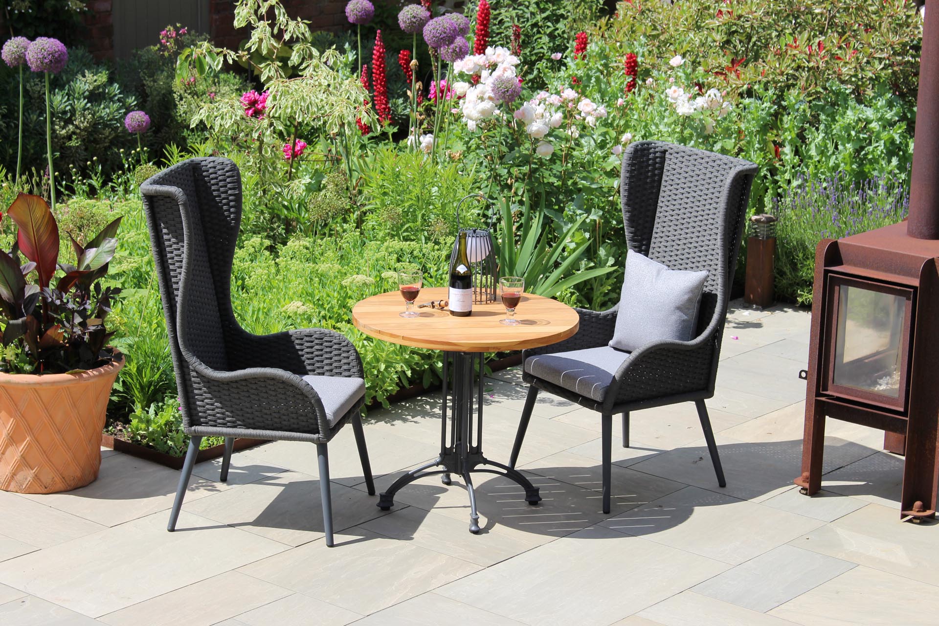 mauritius highback armchair & pigalle and antibes table with scatter cushion