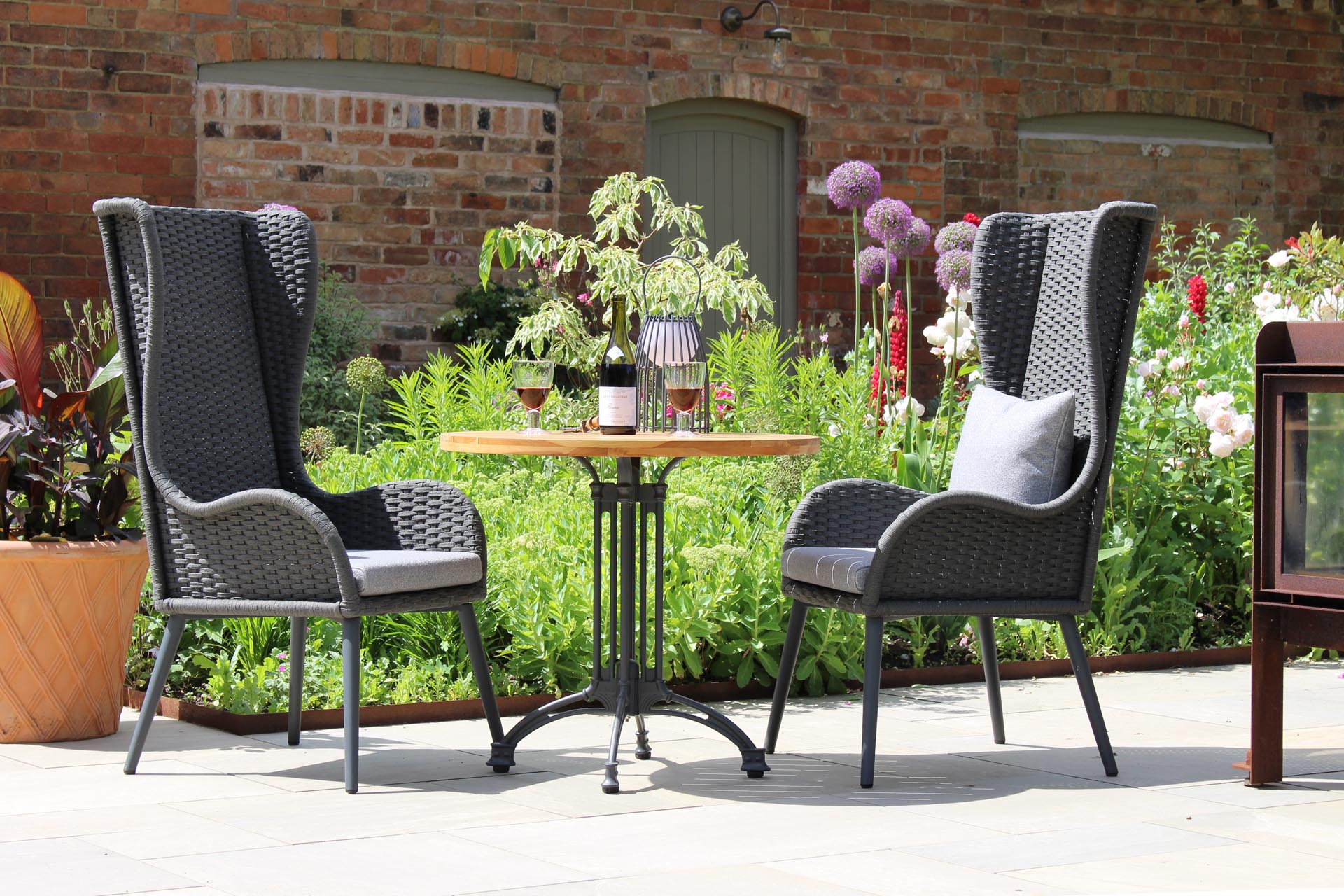 mauritius highback armchair & pigalle and antibes table with scatter cushion